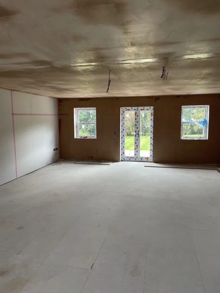 Close-up of flawless smooth skim coat plaster finish on freshly plastered walls at Wentworth S62 Sheffield — crisp edges and zero trowel marks, the P&R Solutions standard