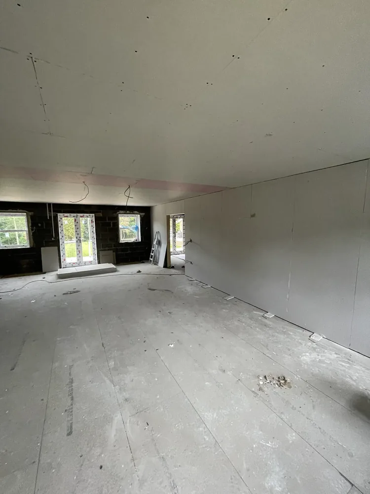 Dry lining and plasterboard installation in Sheffield — dot-and-dab plasterboard fixed to stud partition, taped, jointed and finish skimmed by P&R Solutions Sheffield plasterers