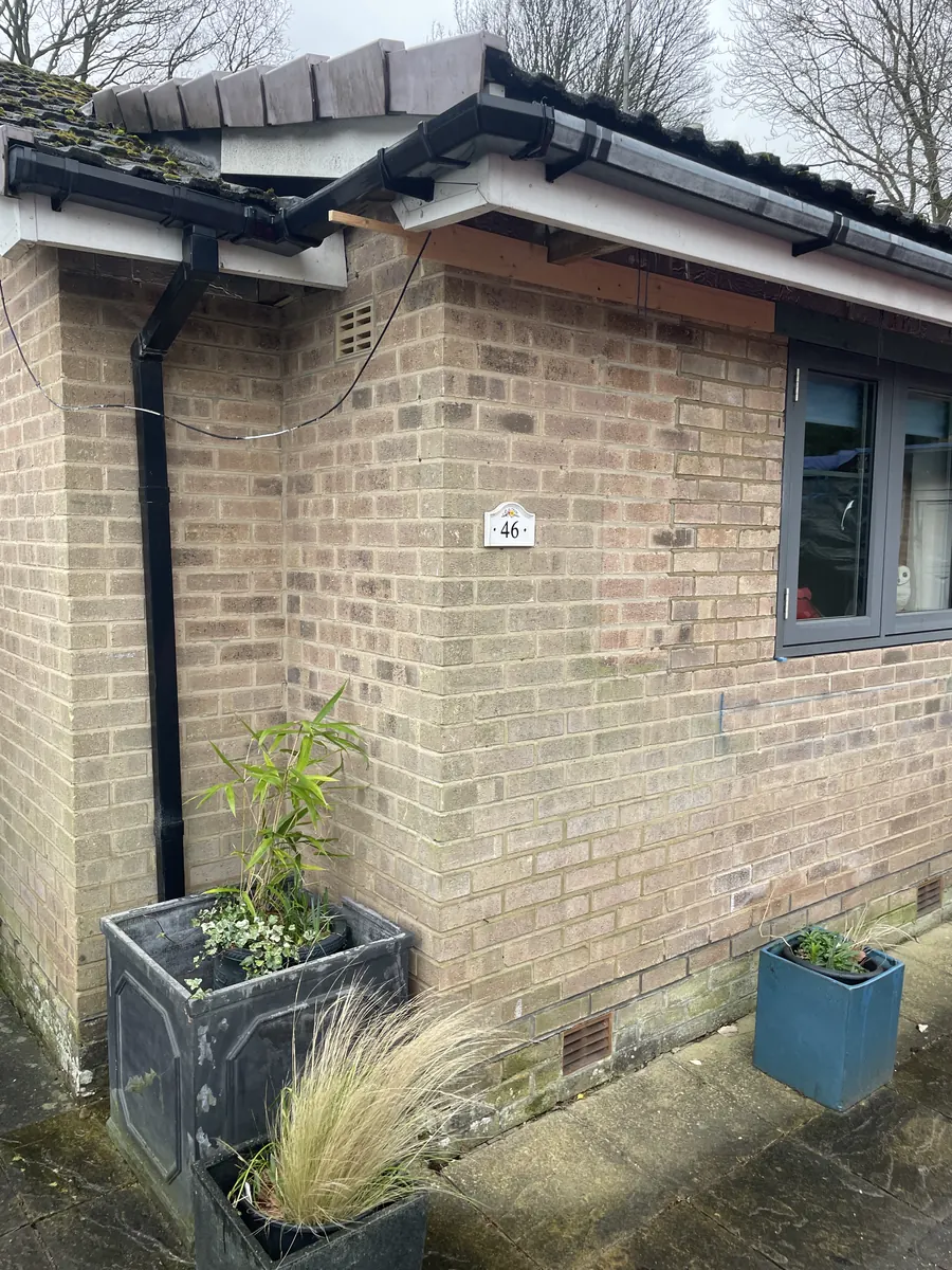 Before — original entrance door and bare brickwork, S17 Sheffield