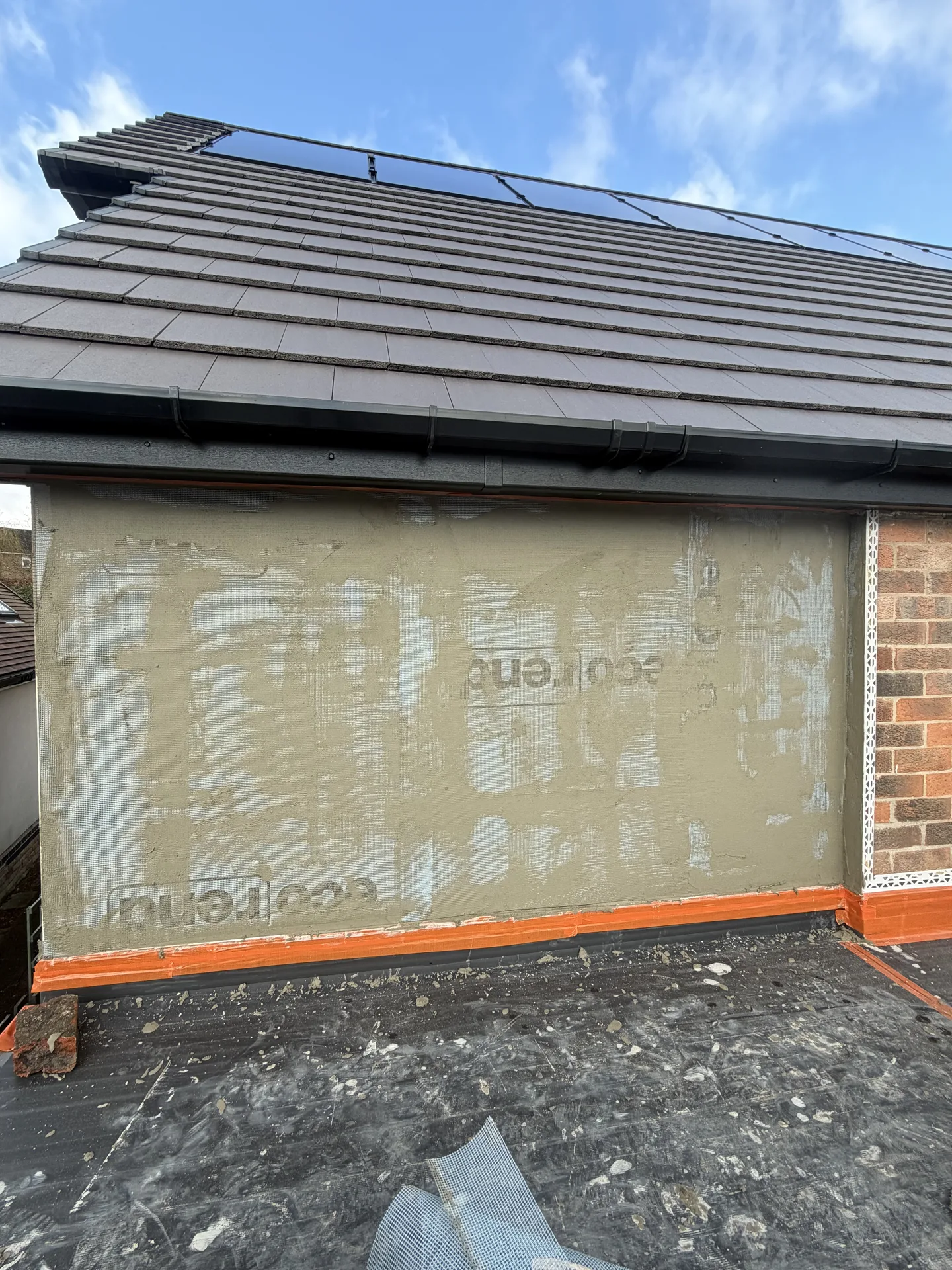Stage 2: Ecorend base coat applied to gable wall — Sandygate Sheffield silicone render by P&R Solutions