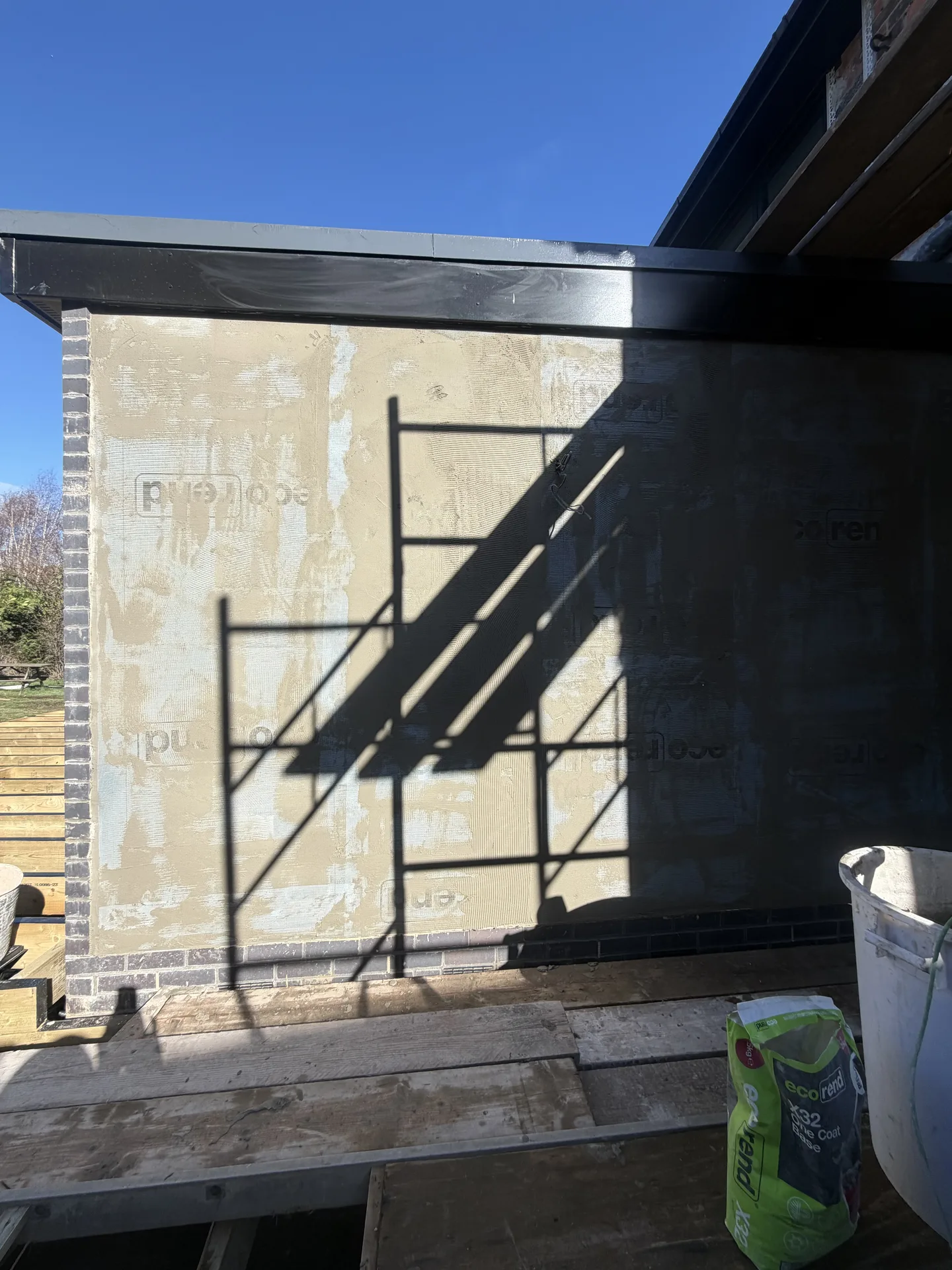 Stage 2c: Base coat curing in sun — Sandygate Sheffield silicone render by P&R Solutions