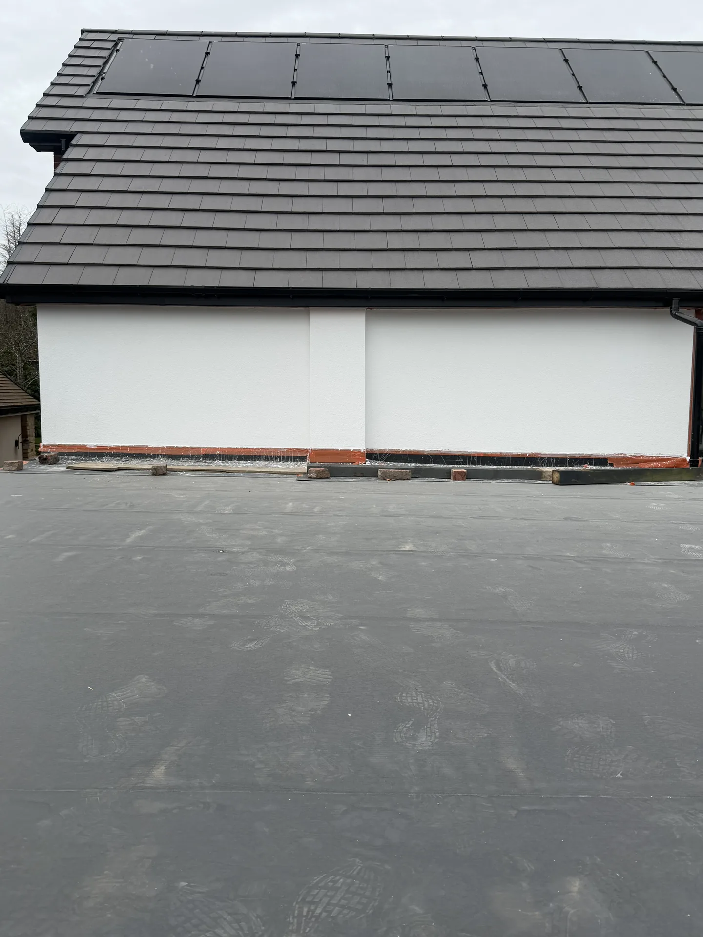 Stage 4d: Gable wall sections finished in Ecorend Marble White above flat roof — Sandygate Sheffield by P&R Solutions