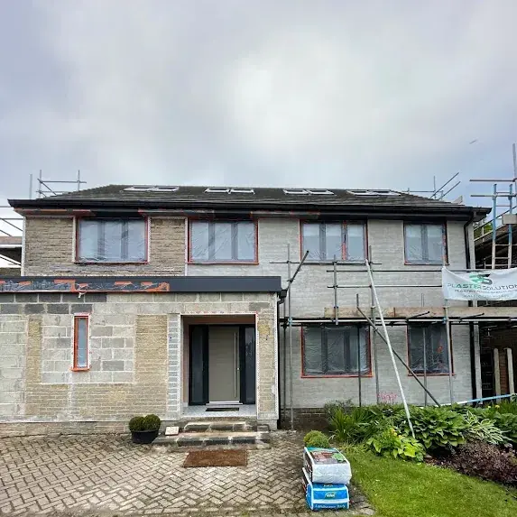 Before silicone render — tired pebbledash Sheffield property