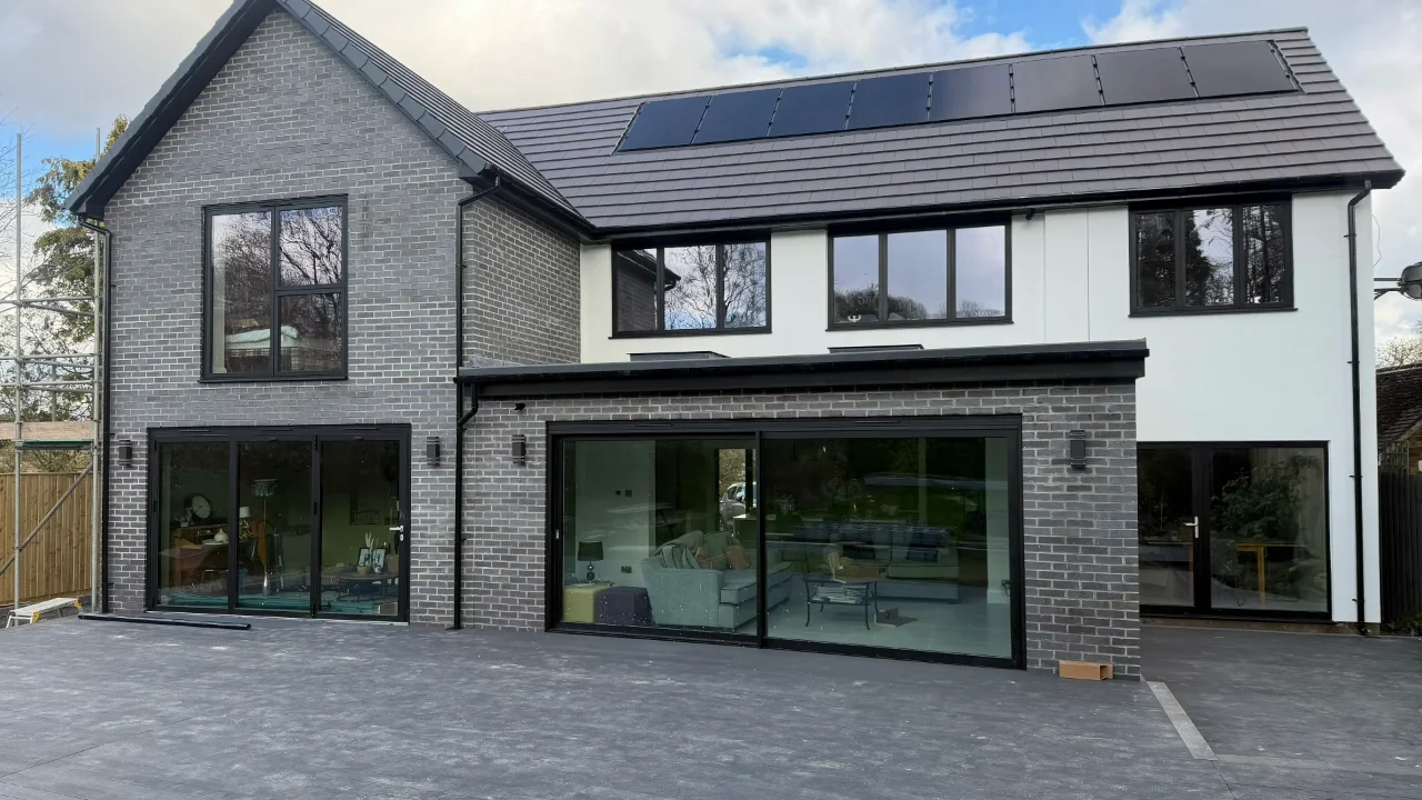 Silicone render being applied to a Sheffield property by P&R Solutions — showing the full process from mesh to finished coat